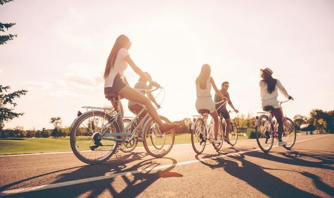a group of people riding bikes